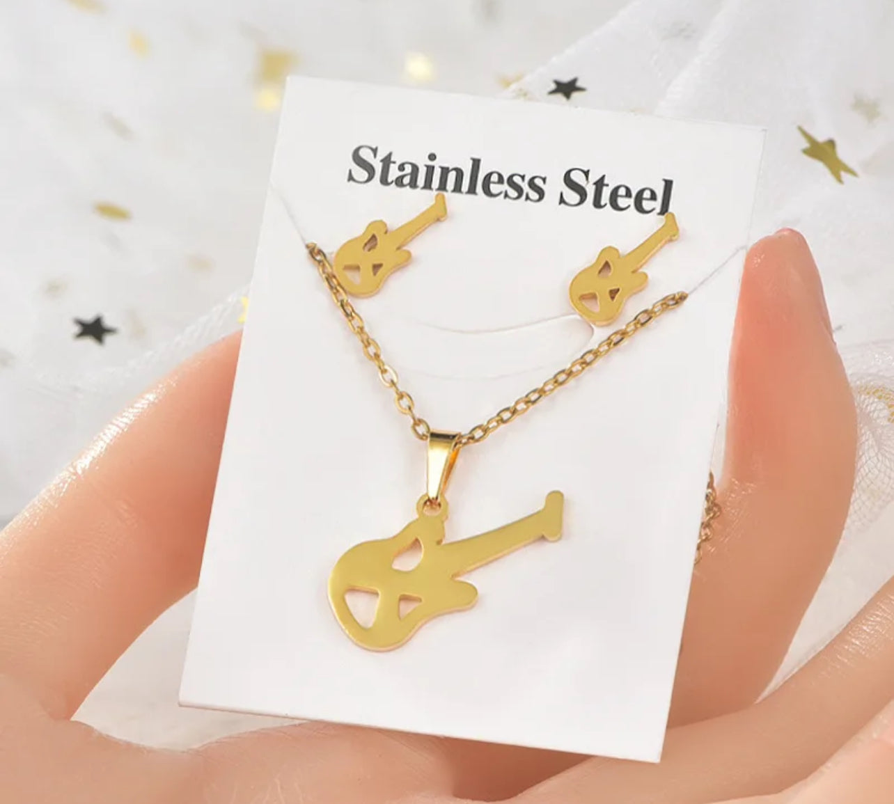 Melody of Style: Stainless Steel Treble Clef Necklace and Earrings Set